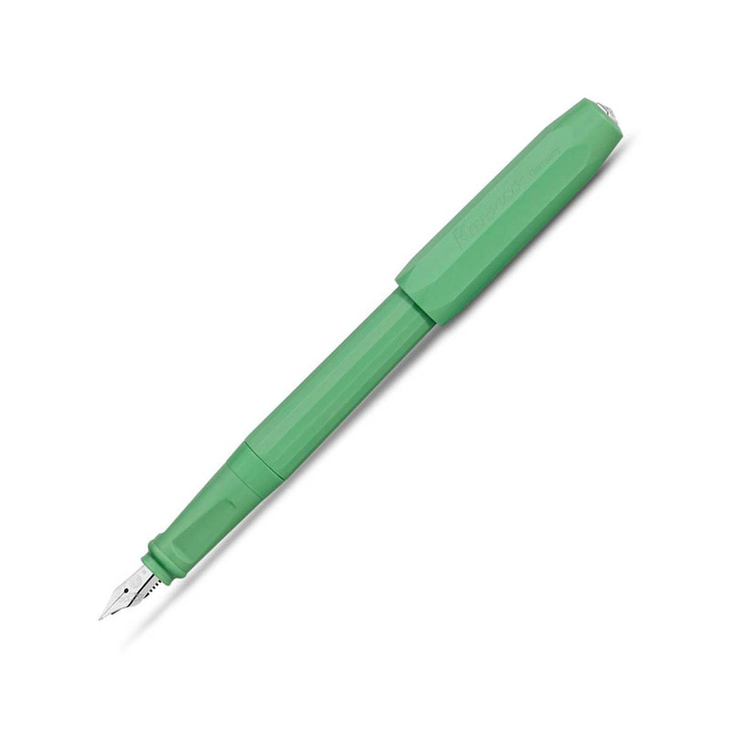 A green fountain pen with a silvertip nib and the matching green cap secured on this other end. 