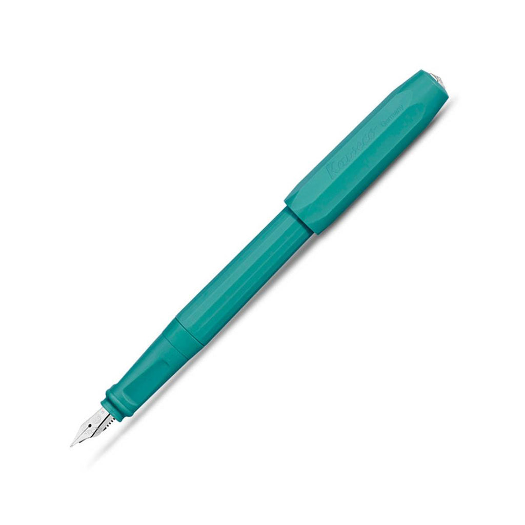 A teal fountain pen with a silvertip nib and the matching teal cap secured on this other end. 
