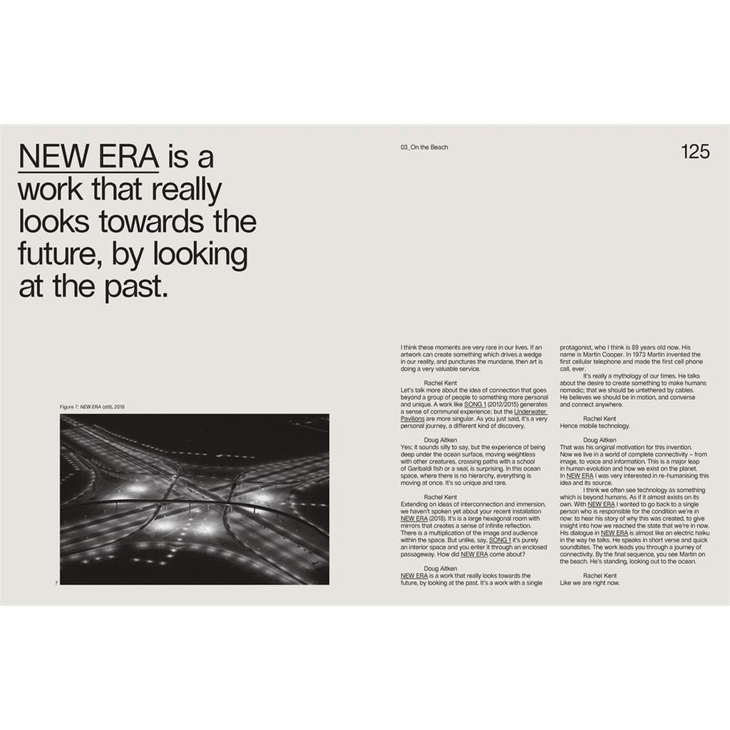 A double-page spread with a cream grey background has a black and white photo at the bottom left corner with a title, "New Era is a work that really looks towards the future, by looking at the past" in a black sans-serif font. On the right are two columns of black text.  