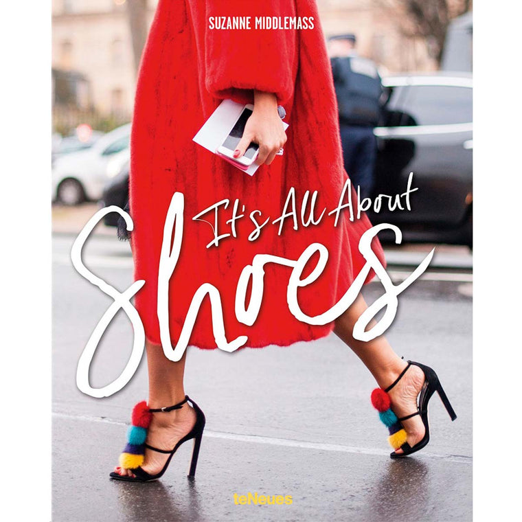 A book cover featuring a person in a red coat and fantastic black stilettos with colourful pompoms.