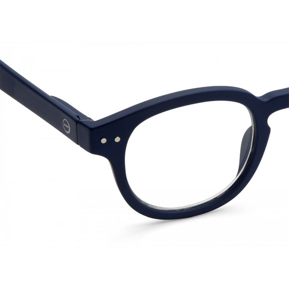 A navy blue pair of magnifying reading glasses. The frames are an stylish, bold, square shape.