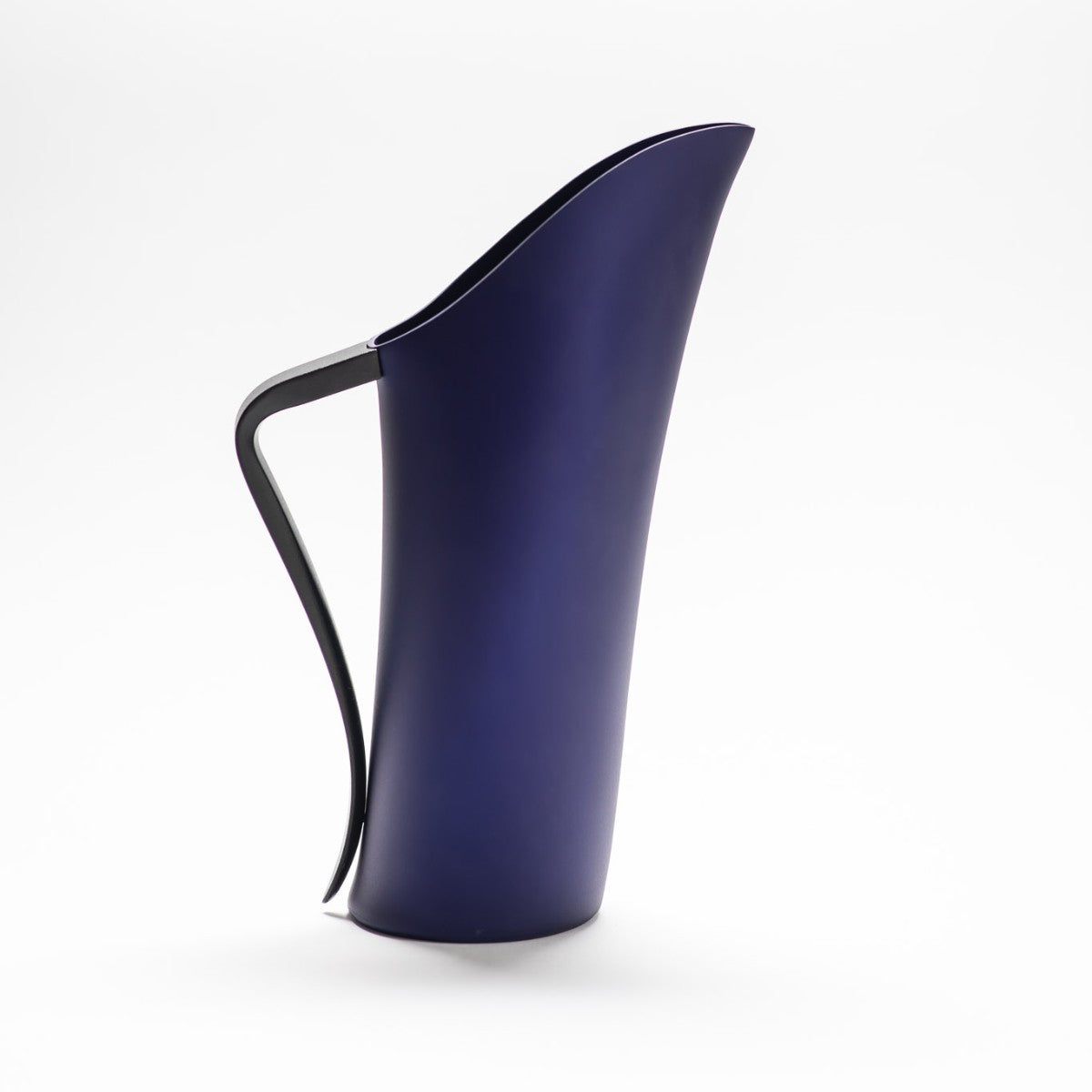 A finely designed sculptural deep blue jug made of anodised aluminium.