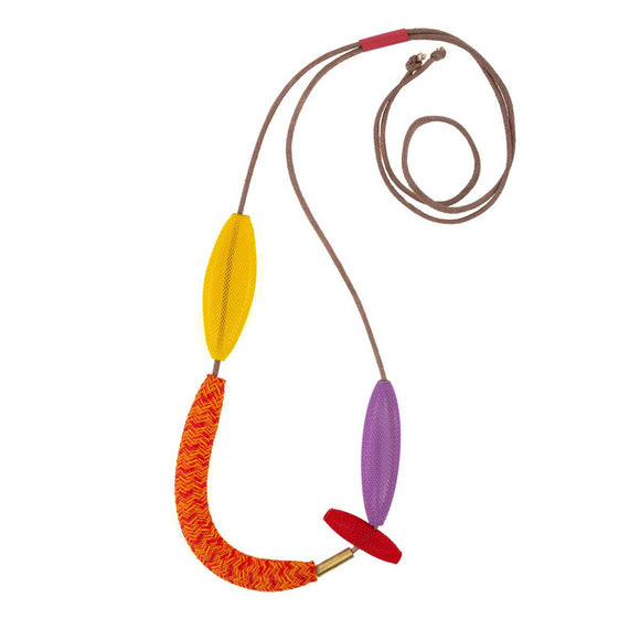 A necklace in variegated red, orange, yellow and purple. Variegated beads made of heat tr seated nylon are strung on a waxed cotton cord.
