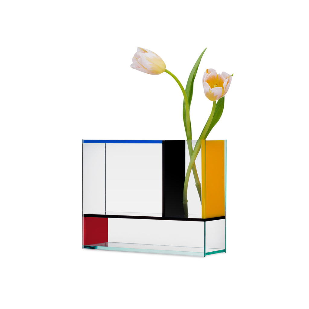 An Acrylic vase inspired by the works of the de Stijl art movement and the block colours of Mondrian. The Vase contains three different chambers and is made of acrylic sheets in clear, blue, red, yellow and black