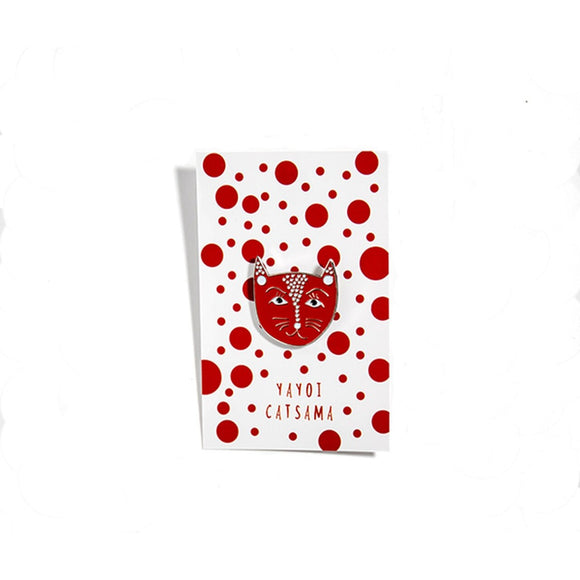 Image featuring an enamel pin in the center which is inspired by the artist Yayoi Kusama