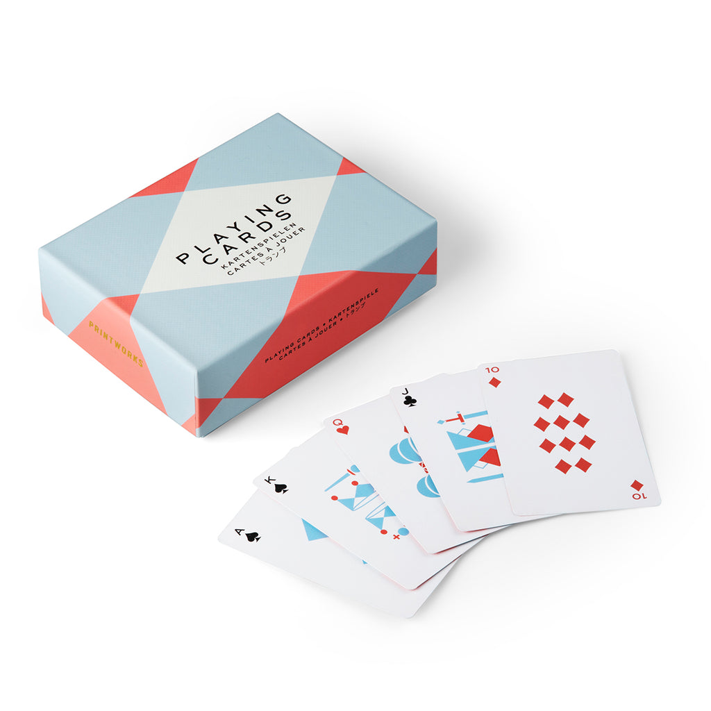 A rectangular box with a white, red and light blue diamond pattern has its white playing cards with matching red and blue graphics in the centre. 