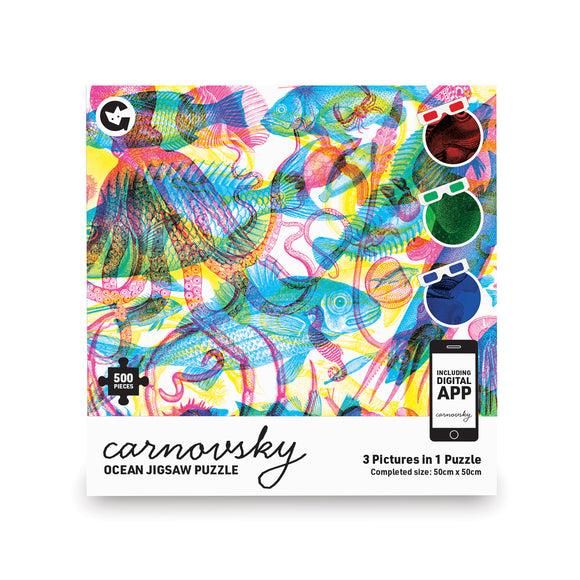 The square packaging box has the image of detailed illustrated sea creatures overlapping in magenta, cyan and yellow. Below is a white bar with 'carnovsky' cursive in black over 'ocean jigsaw puzzle' in a sans-serif font. On the right is 'including digital app' on a smartphone icon with '3 pictures in 1 puzzle' below it. 