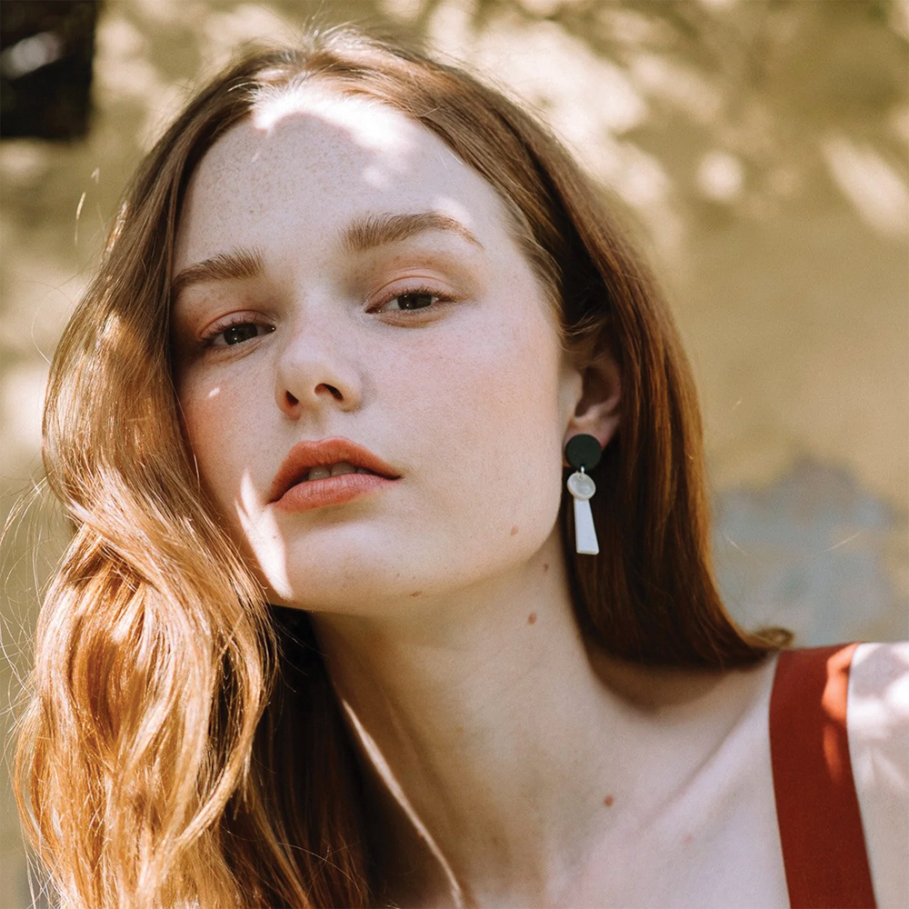 Girl wearing 2025 tassel earrings