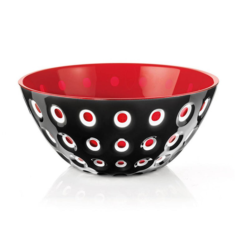 Red on the inside and black on the outside, the bright bowl has a transparent circle pattern where each circle is framed in white. 