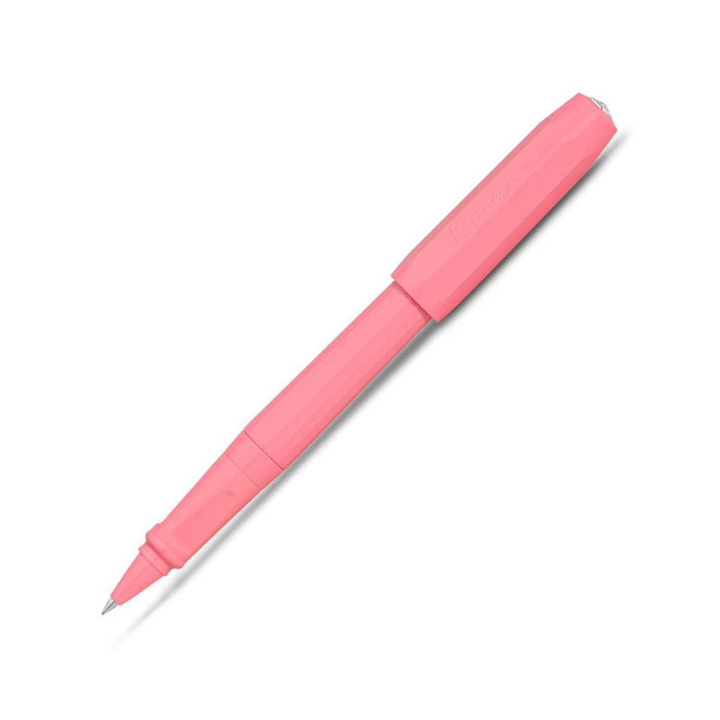 A matte pink pen has a rollerball nib and a matching pink cap secured on the other end.   