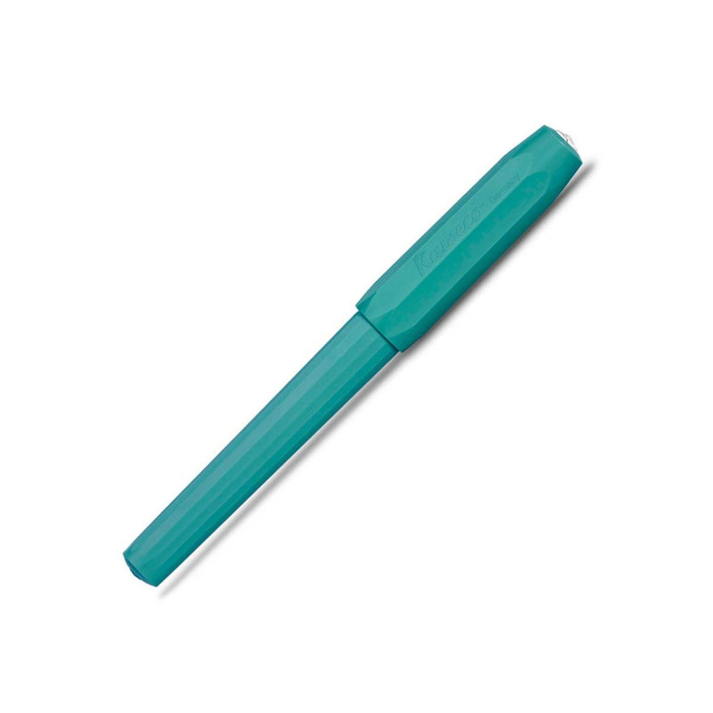 A teal pen with its cap on has faceted sides. 