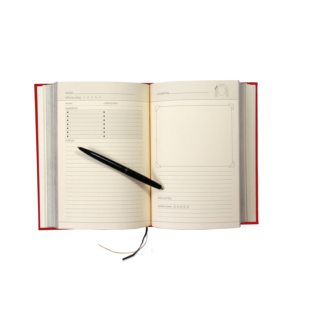 A black pen lays on the recipe journal's blank pages with two columns for ingredients, lines for the recipe, and an empty rectangle to insert a photo. 