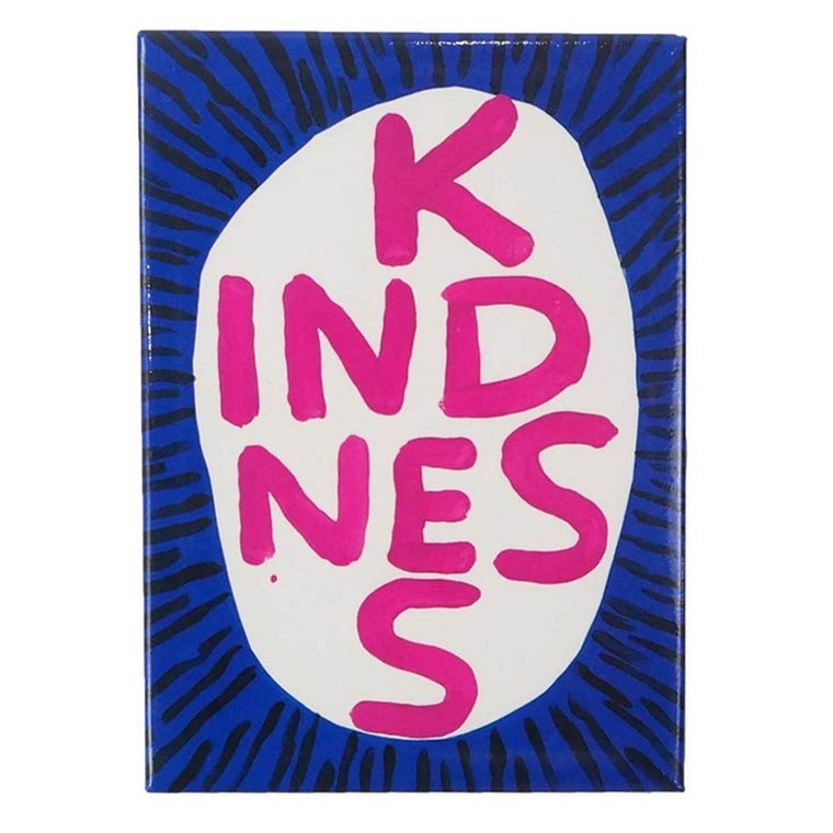 A white rectangular magnet with a hand-painted capitalised text, 'KINDNESS' in pink inside a white circle surrounded by black lines on a cobalt background. 