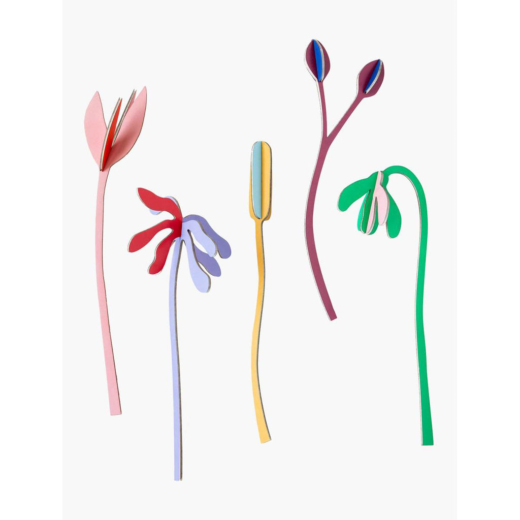 Five 3D cardboard flower stems, each a different solid colour of pink, lavender, yellow, maroon and green. 