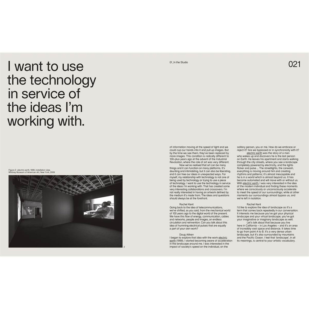 A double-page spread features a black and white photo of a video installation in a gallery and black text. 