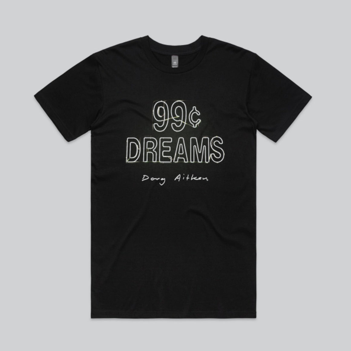 A black t-shirt has "99c dreams" capitalised and outlined as a neon sign with "Doug Aitken" below it in Aitken's handwriting. 