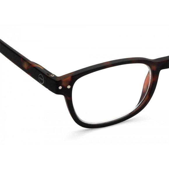 A pair of magnifying reading glasses. The frames are an elegant, classic, rectangular shape in a mottled classic tortoise shell finish.