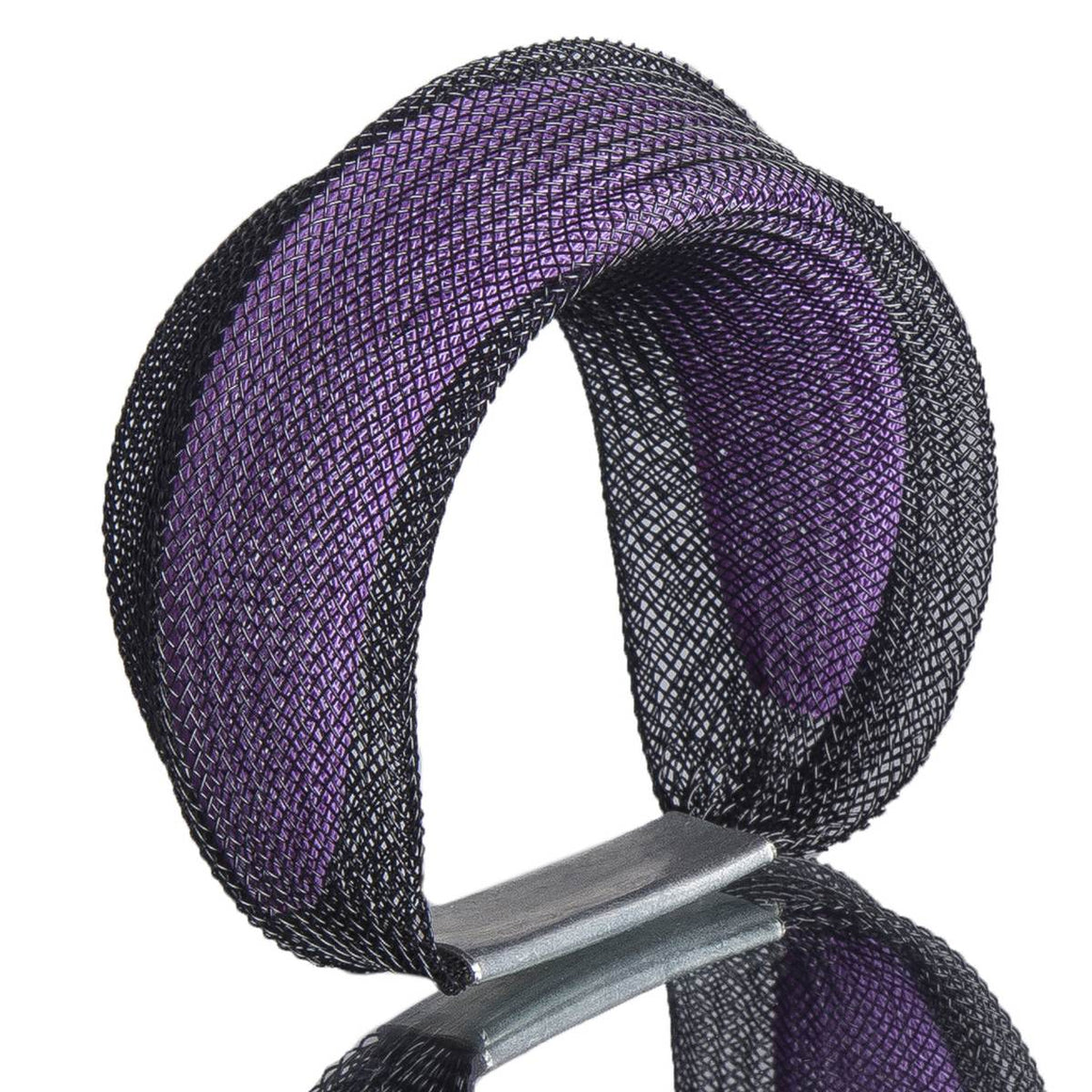 A black and purple bracelet made from finely woven nylon mesh. A purpler mesh tube in visible contained inside a black mesh tube.