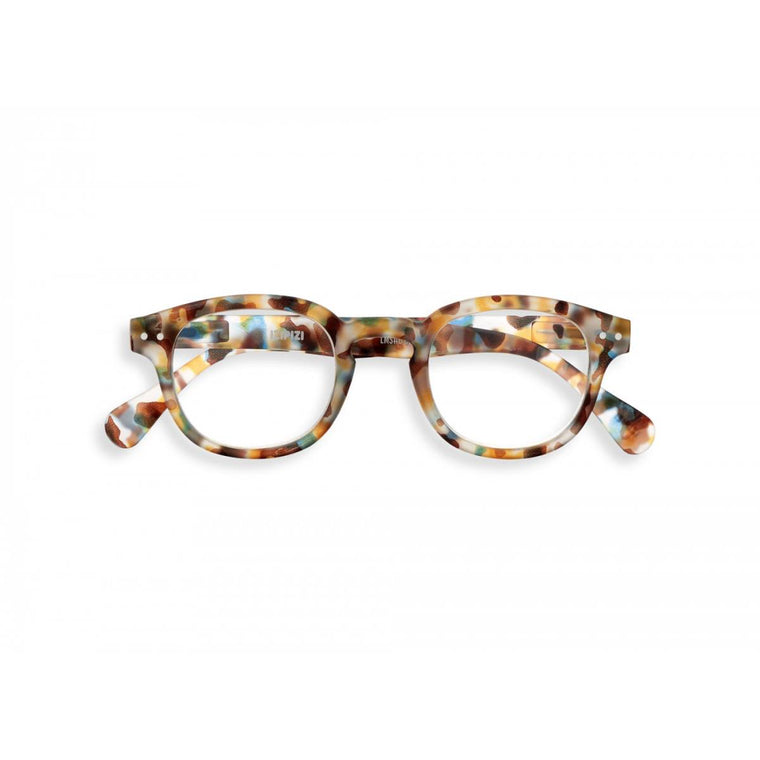 A pair of magnifying reading glasses. The frames are an stylish, bold, square shape in a mottled blue tortoise shell finish.
