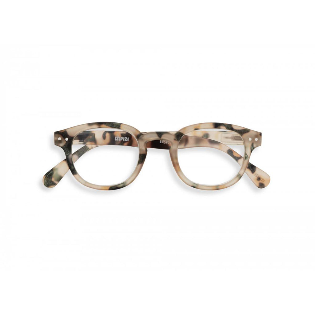 A pair of magnifying reading glasses. The frames are an stylish, bold, square shape in a mottled light tortoise shell finish.