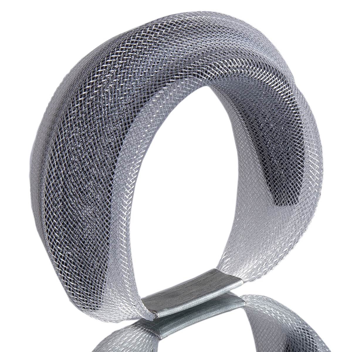 A Black and clear bracelet made from finely woven nylon mesh. A black Mesh tube is visible contained inside a clear mesh tube.