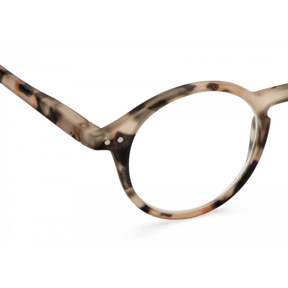 A pair of magnifying reading glasses. The frames are an round, timeless, best-selling shape in a mottled light tortoise shell finish.