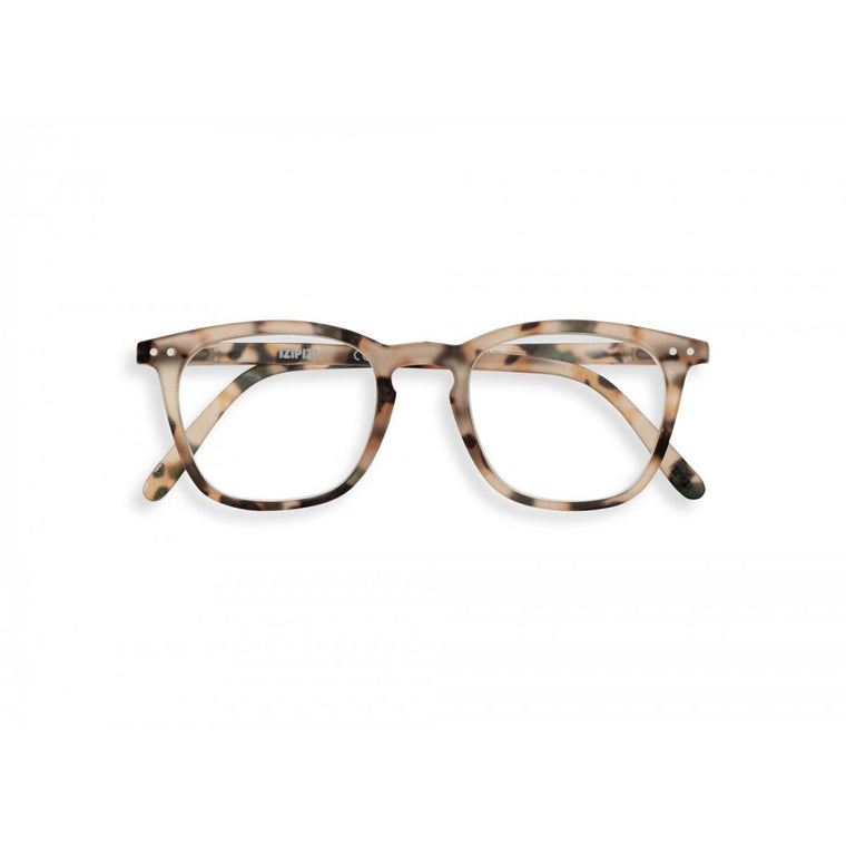 A pair of magnifying reading glasses. The frames are a large, structured, trapezium shape in a mottled light tortoise shell finish.