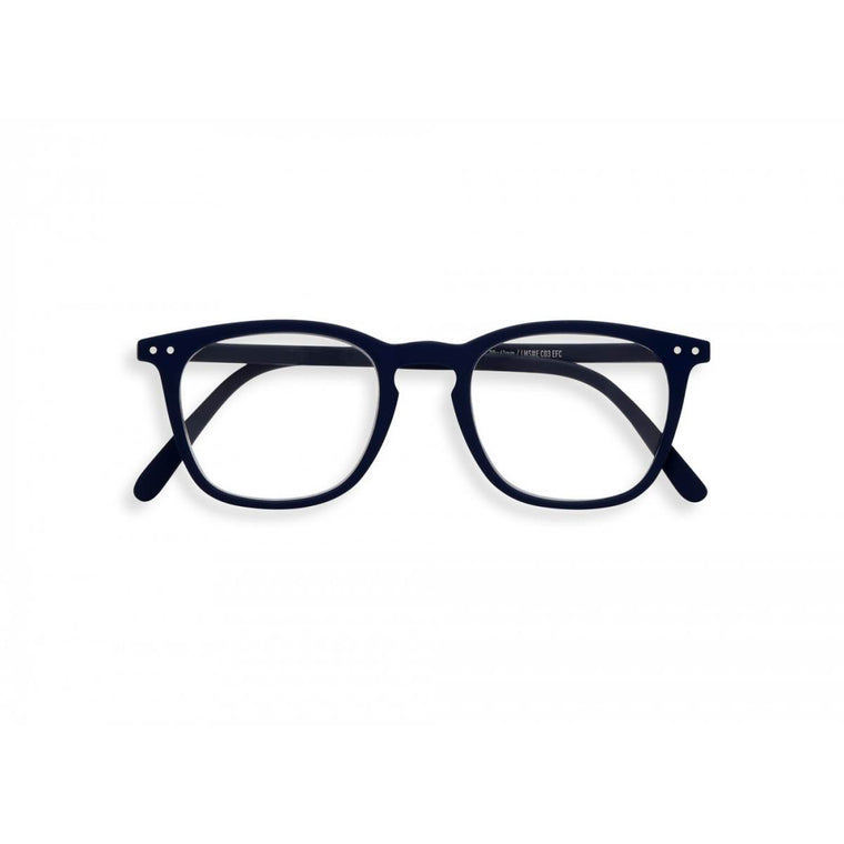 A navy blue  pair of magnifying reading glasses. The frames are a large, structured, trapezium shape. 