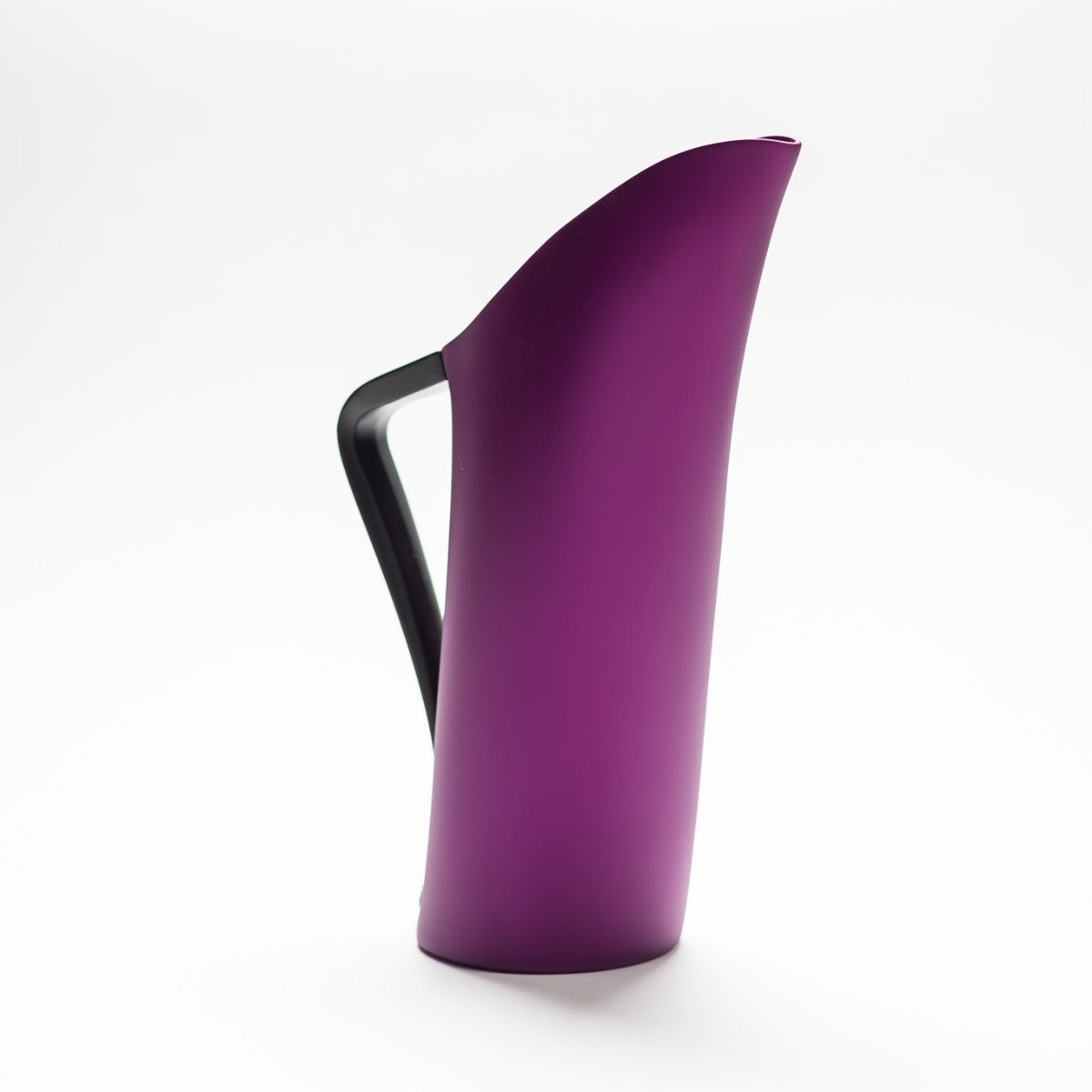 A finely designed sculptural purple jug made of anodised aluminium.