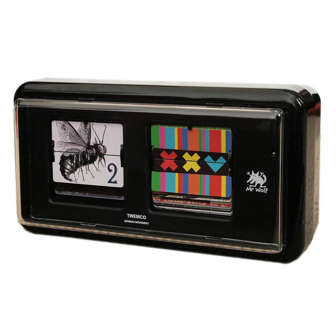A designer clock in the style of traditional 24 Hour military flip clocks. This one however has replaced the traditional number plates with a range of images that refer to numbers. Housed in a black retro flip clock style box.