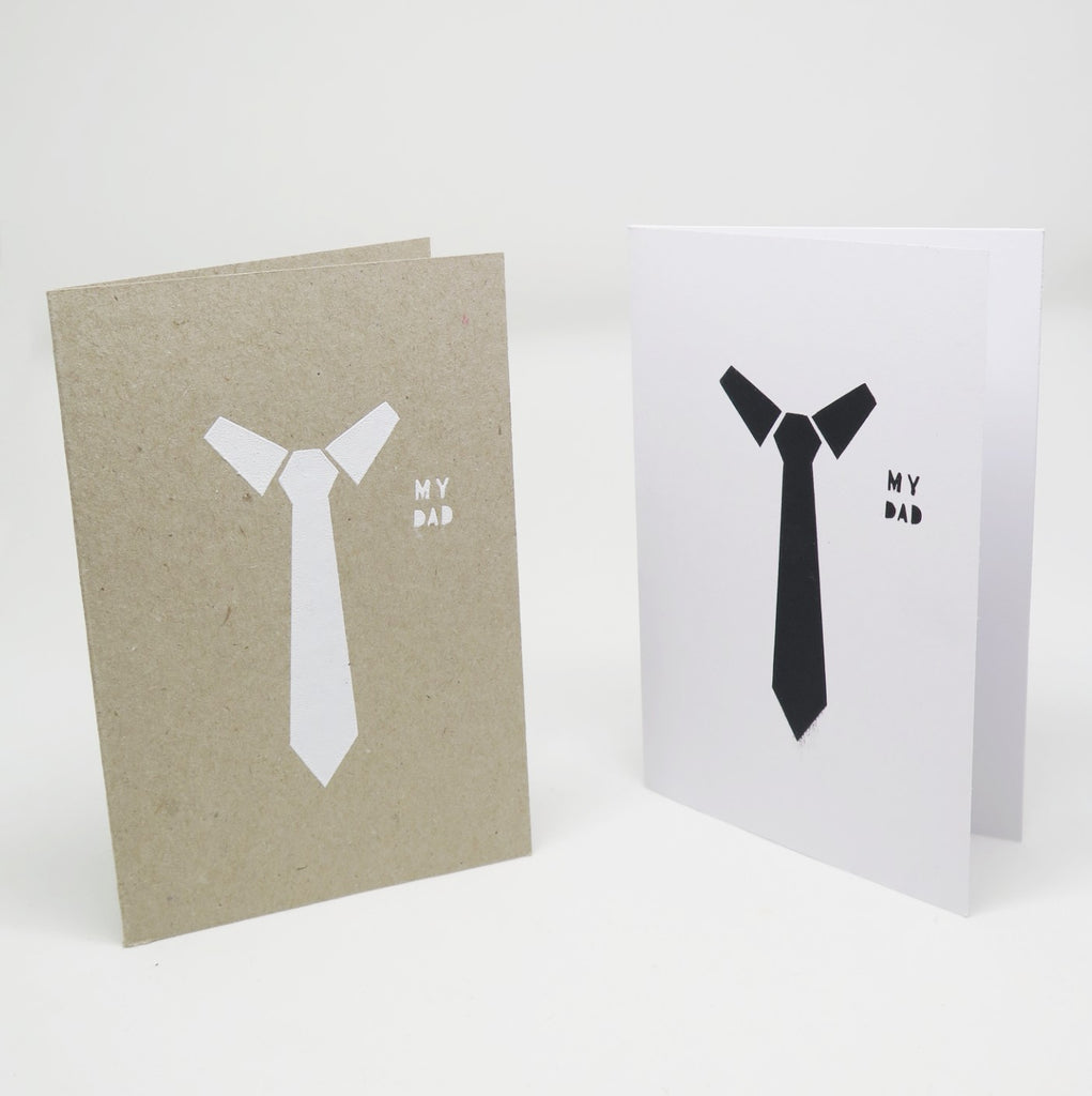 Two Greeting Cards one in white paper and the other in kraft brown paper both which feature a graphic illustration of a collar and tie with the text My Dad besides it