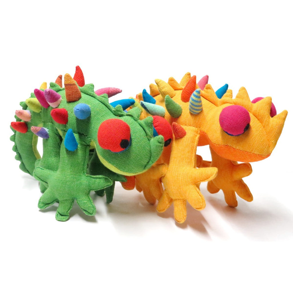 Two brightly coloured soft toys in the shape of thorny devils. One is green and one is yellow.