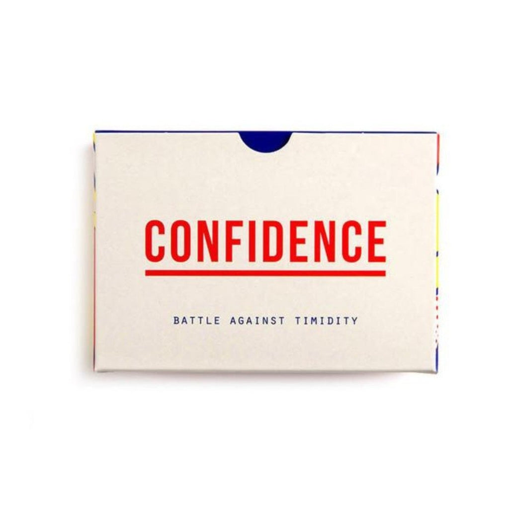 Image featuring a playing card packaging box which has blue trim around the beige centre and on the front of the box has red font text which states the word Confidence and then the word Battle against Timidity - below it