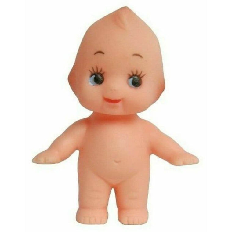 A vintage style Kewpie doll, shown standing. The doll is nude, cherub- like and features large eyes with distinct eyelashes.