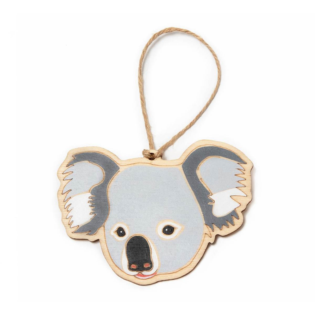 A hanging ornament in the form of a Koala. Laser Etched flat wood is adorned with dark grey, light grey, black, white and peach hand painting. A Jute string is attached