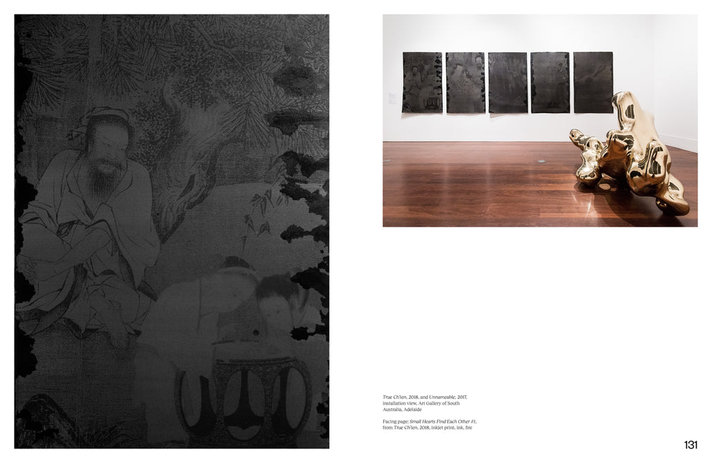 On the left page is the "Small Hearts Find Each Other #1" print showing a grey print on black paper of an older Asian man overlooking two young females playing board games. On the right is a photograph of "True Ch'ien" and "Unnamable" installation view displaying five grey on black papers hanging on the wall behind a gold abstract sculpture. 