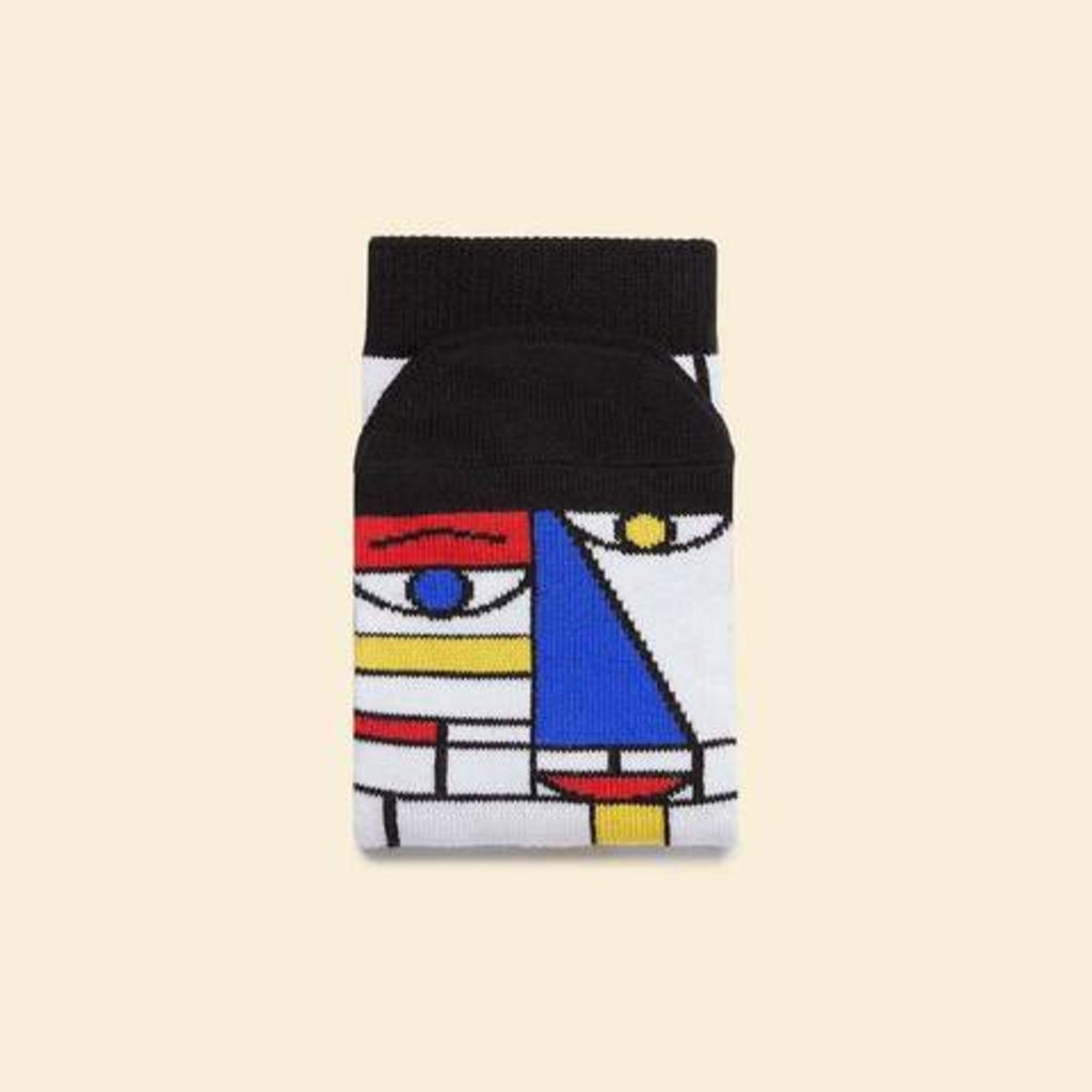 Image featuring a pair of socks with a graphic illustration inspired by the work of Piet Mondrian