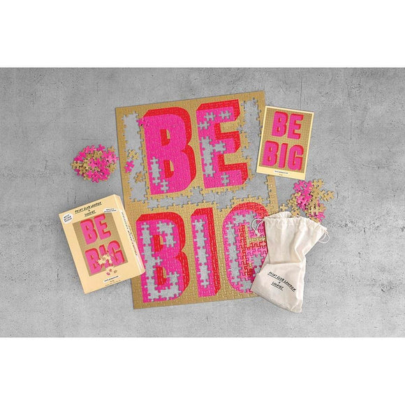 Tan packaging featuring an image of the completed puzzle with the text Be Big on the front