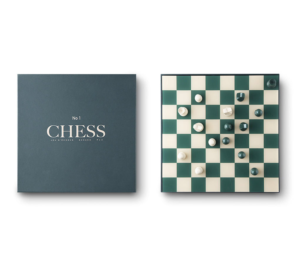 Image featuring a white background with a classically designed green and cream chess set including pieces and green packaging box