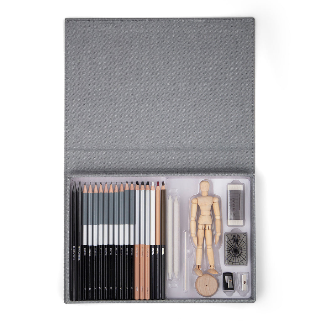 An opened grey kit shows the sketching kit content of sharpeners, pencils and a posable wooden mannequin. 