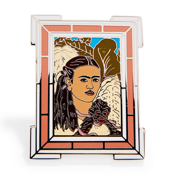 An enamel pin featuring a version of Frida Kahlo's 'Fulang-Chang and I'