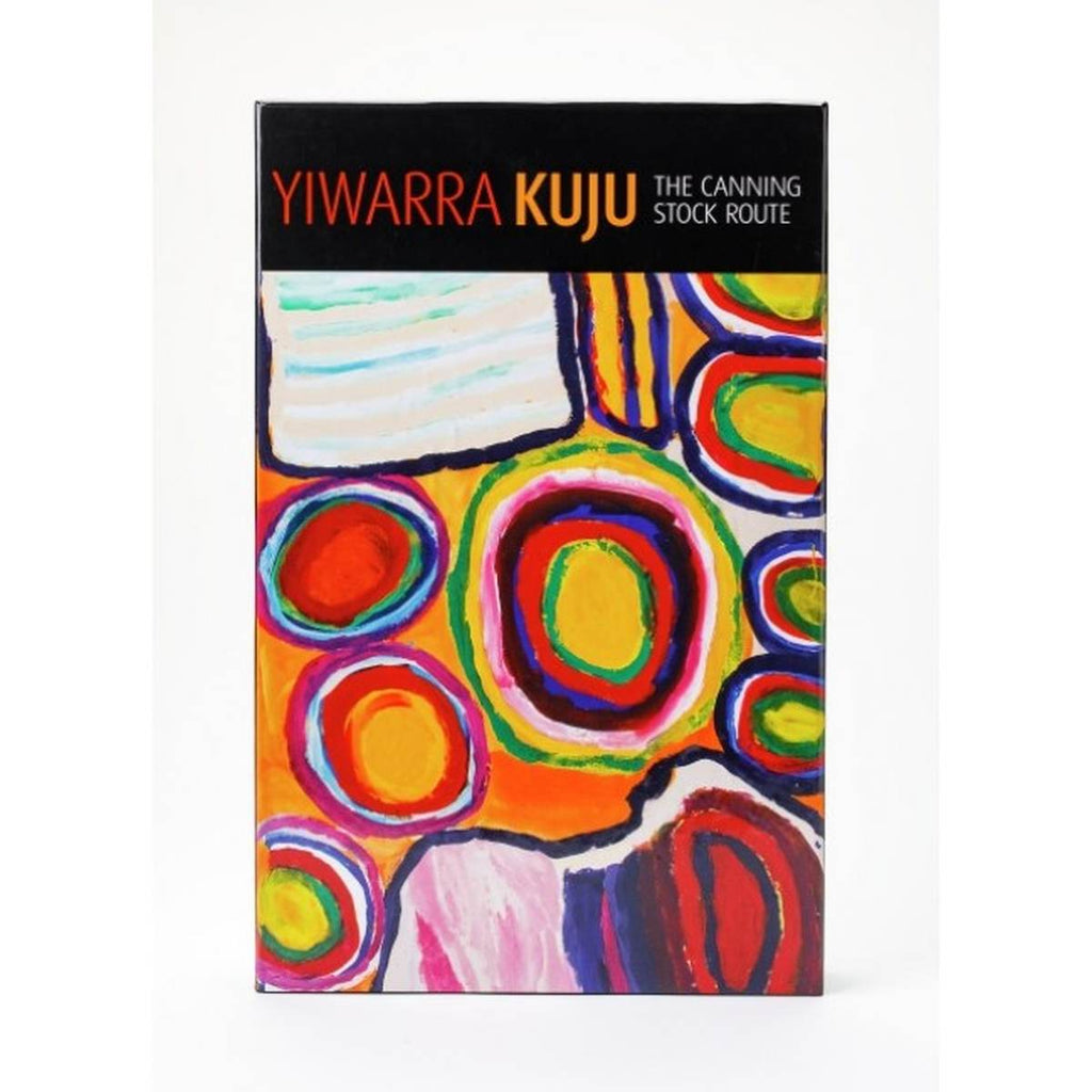 A puzzle box entitled " Yiwarra Kuju The Canning Stock Route" featuring artwork by Dadda Sampson. Bold circles and other shapes in bold contrasting colours