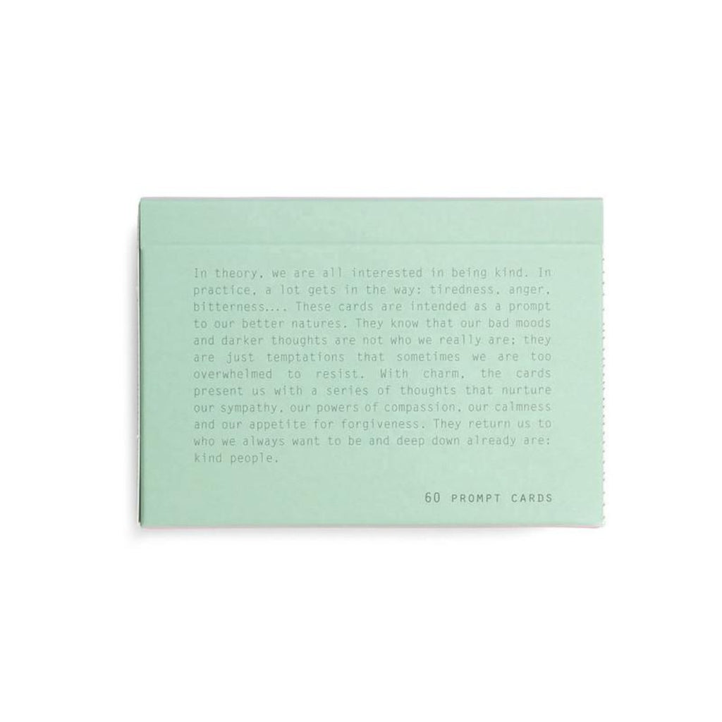 The back of the pastel green rectangular box is the 'Kindness' blurb in green text. 