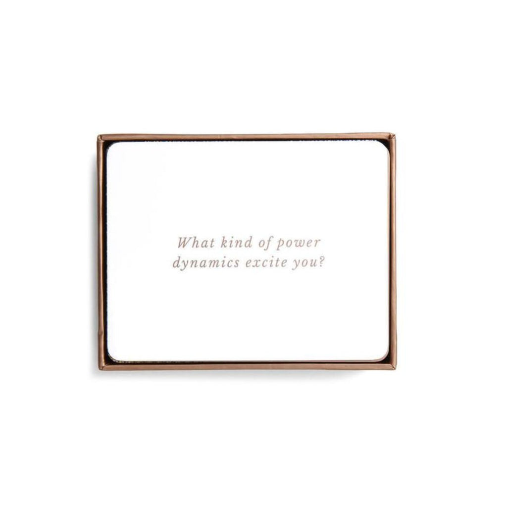 Image featuring one of the cards which are included in the box - this card says in gold font: What kind of power dynamics excite you?