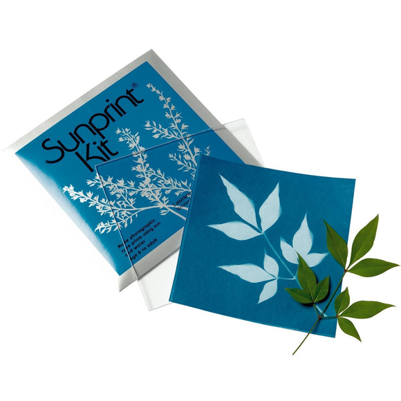 Image featuring the sunprint blue packaging, glass, blue sheet and leaf 