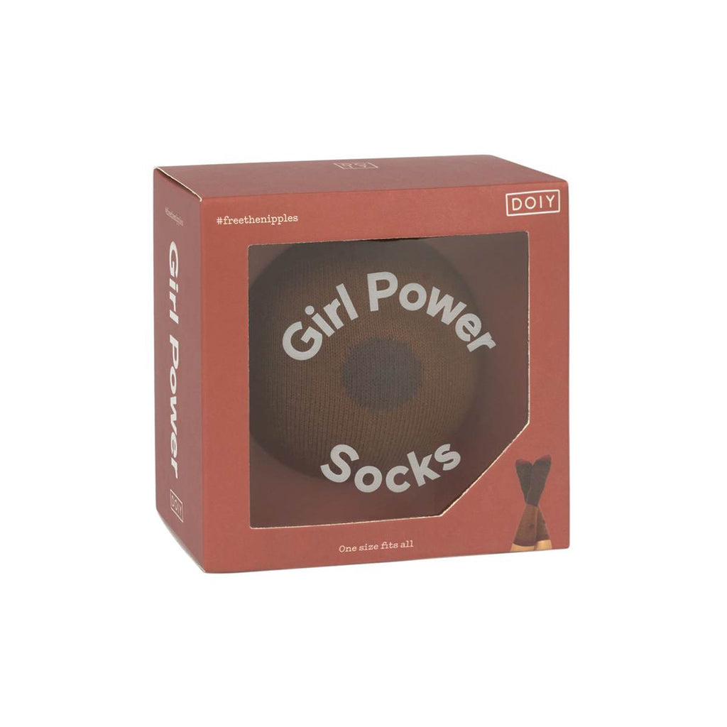 A Pair of Printed socks in a box featuring a brown skin tone and nipple print. They are printed and rolled to look like a breast when packaged. The box shows the text "Girl Power Socks"