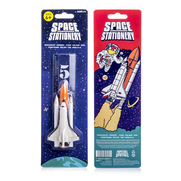 a stylised stationary set compiled to look like a Space Shuttle. Shown is a Space Shuttle eraser, a orange 'rocket' pen, two white pencil 'boosters' and a clear ruler printed with a countdown from 5 to 1.