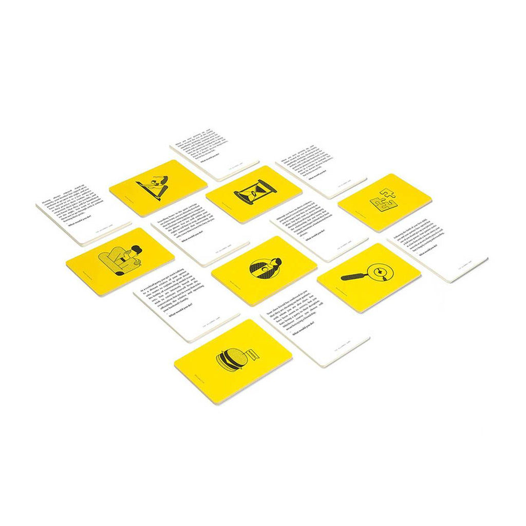 On a white surface is a grid of white cards laid vertically and yellow cards laid horizontally. 