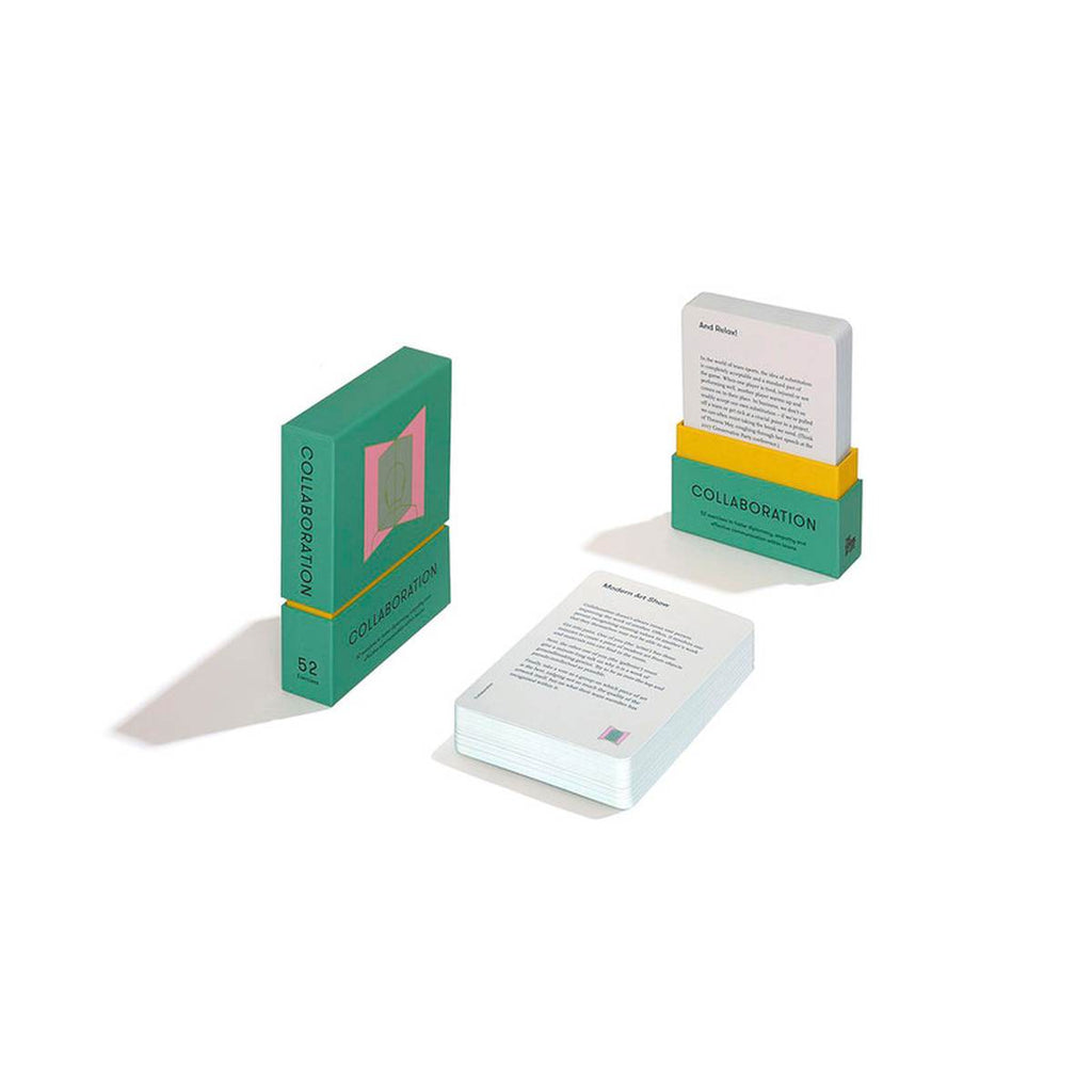 A green box with a pink rectangular graphic on the top centre faces the long side of the white cards piled in the centre. Facing the top of the card deck is a lidless green case with 'collaboration' in black and a yellow interior holding a stack of cards upright. 