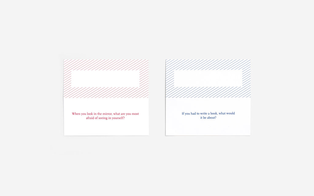 Two white squares have the top half borders with diagonally stripes around the blank rectangle. The bottom has questions in the same colour as the stripe; the left is red with "when you look in the mirror, what are you most afraid of seeing in yourself?". On the right is blue with the question "if you had to write a book, what would it be about?".  